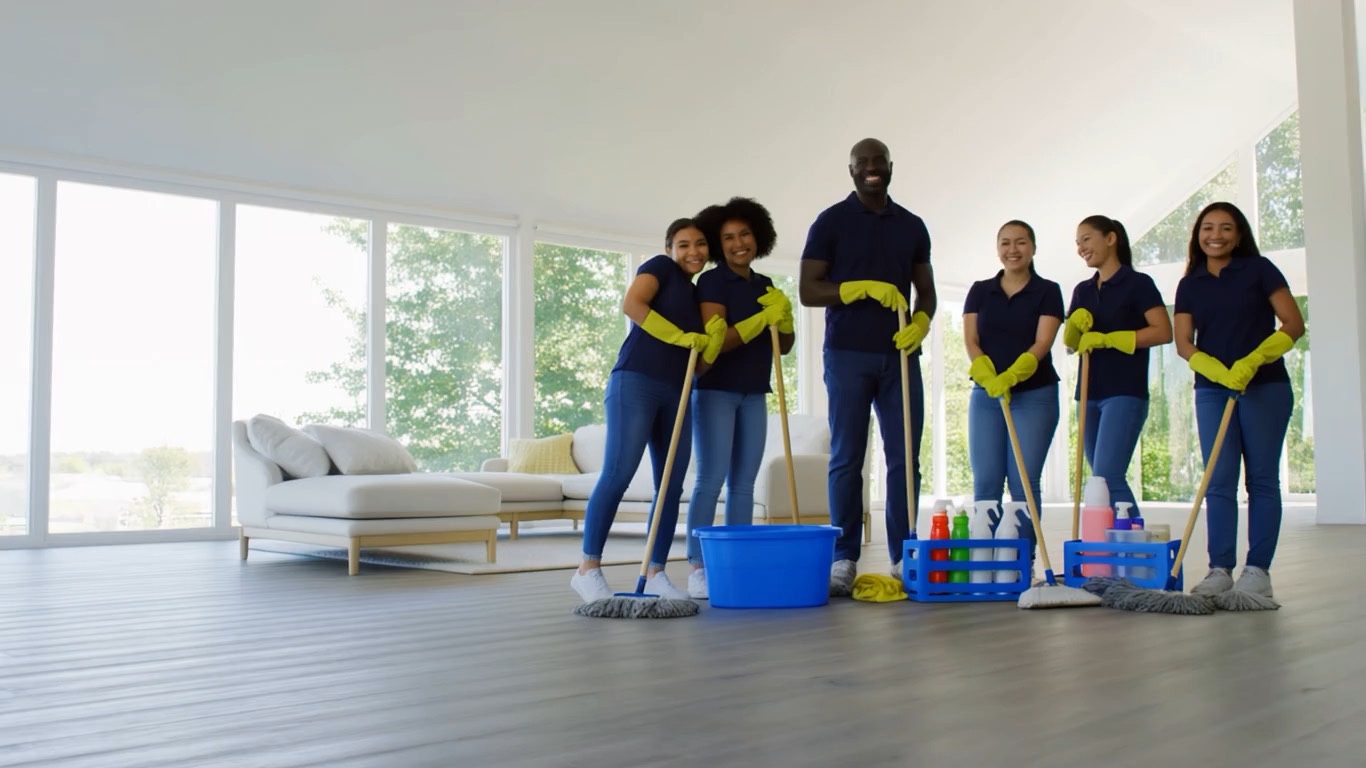 The Home Refresh crew in a bright living room